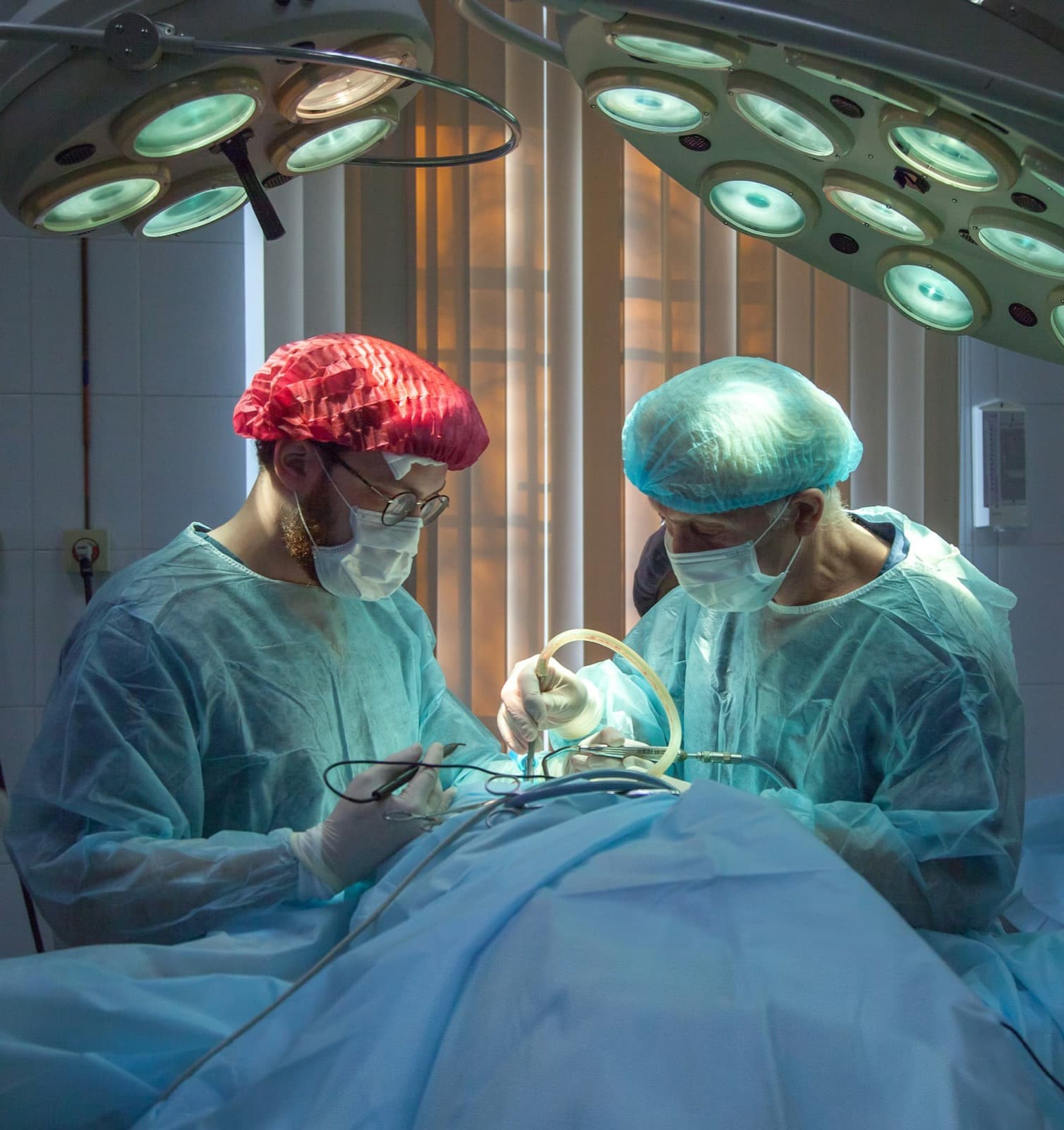Surgeons performing a procedure in a modern operating room