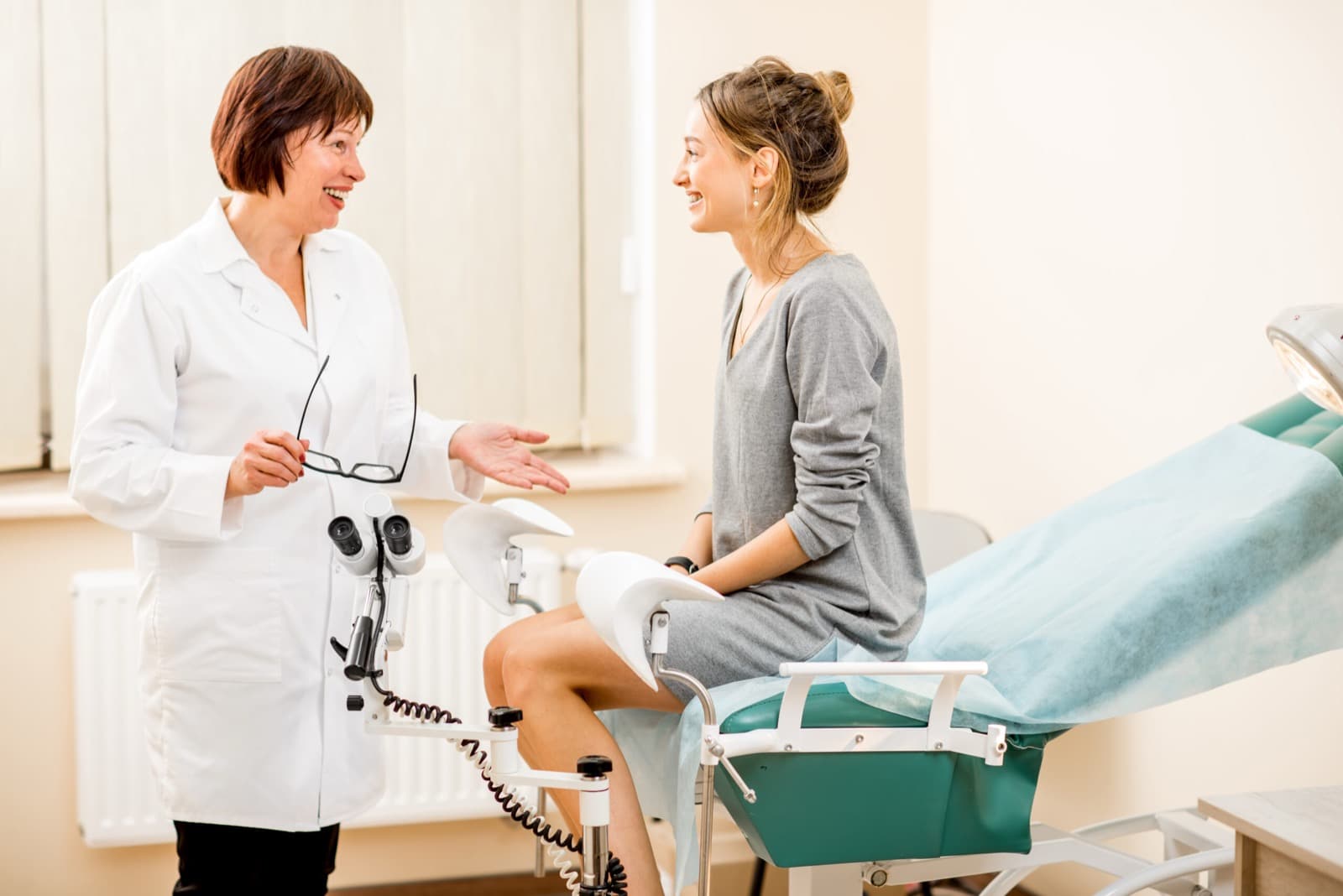 Gynecologist consulting with a patient in a women’s health clinic